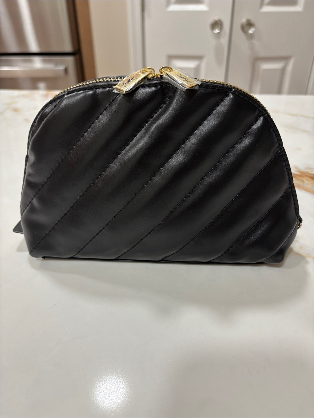 YSL black faux leather cosmetic case with (3) samples